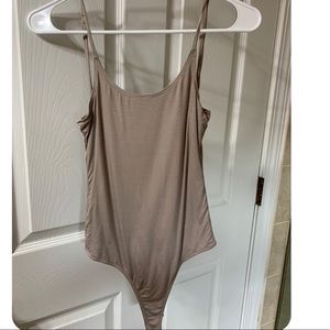 Open back tan body suit